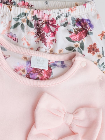 Set Next en rose
