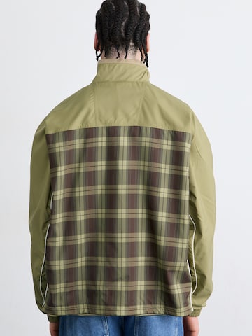 ADIDAS ORIGINALS Välikausitakki värissä vihreä