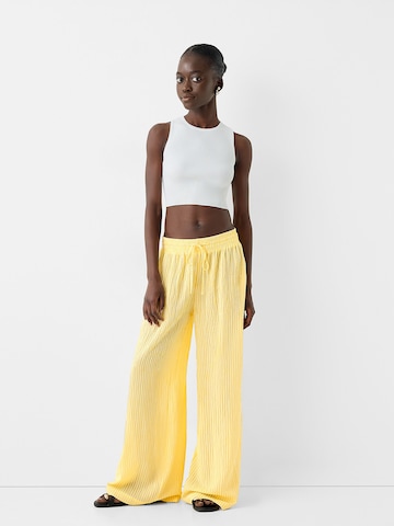 Bershka Zvonové kalhoty Kalhoty – žlutá