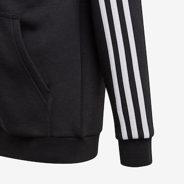 ADIDAS SPORTSWEAR Αθλητική ζακέτα φούτερ 'Essentials 3-Stripes' σε μαύρο