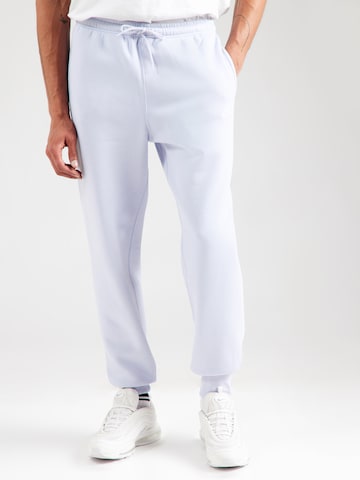 Nike Sportswear Tapered Housut 'CLUB' värissä sininen: etupuoli