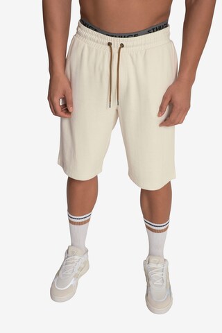 STHUGE Regular Pants in Beige: front