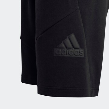 ADIDAS SPORTSWEAR Loose fit Workout Pants 'Future Icons Logo 8-Inch' in Black