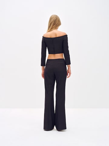 ABOUT YOU x Toni Garrn Flared Pleated Pants 'Elonie' in Black