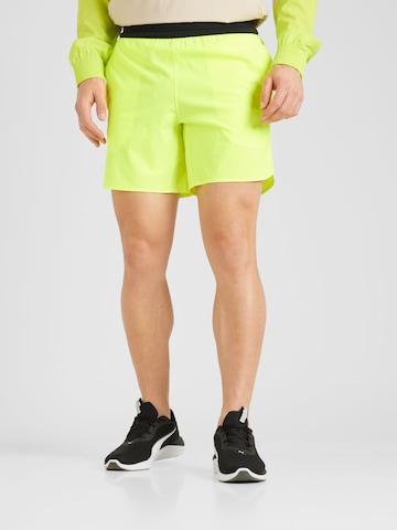 UNDER ARMOUR Regularen Športne hlače 'Peak' | rumena barva: sprednja stran