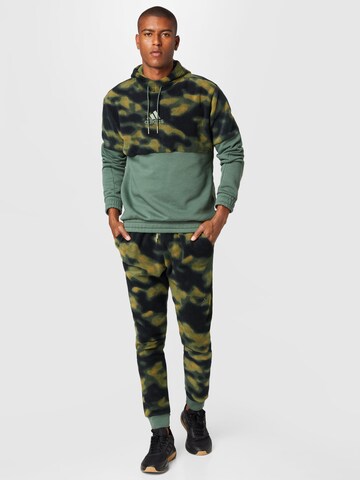 ADIDAS SPORTSWEAR Tapered Sportbroek 'Polar Fleece Nature Print' in Groen