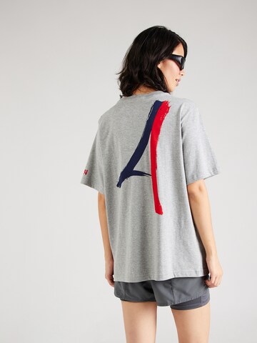 NIKE Performance Shirt 'SUPPORTER' in Grey: front