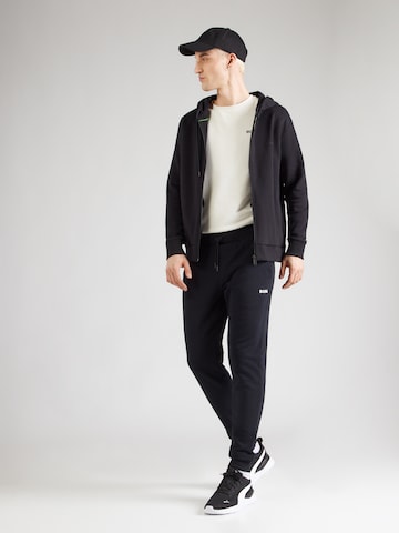 Tapered Pantaloni sportivi 'ESSENTIAL 4' di BJÖRN BORG in nero