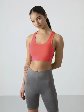 Tommy Life Sporttop in Oranje: voorkant