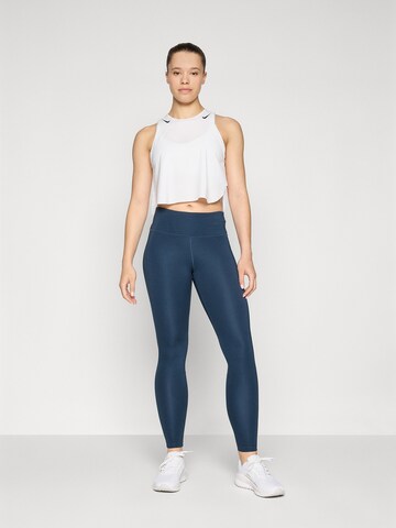 NIKE Skinny Spodnie sportowe 'Epic Fast' w kolorze niebieski