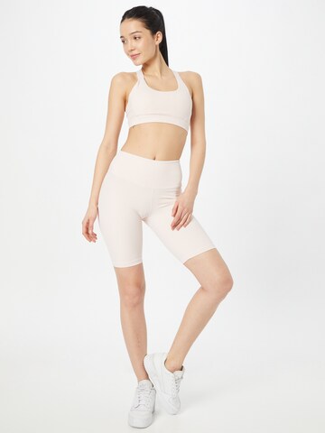 Skinny Pantaloni sport de la KUUNO pe roz