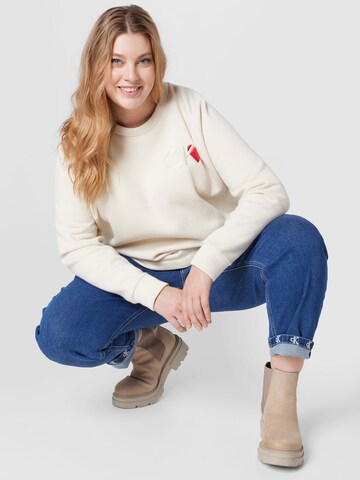 Calvin Klein CurveSweater majica - bež boja
