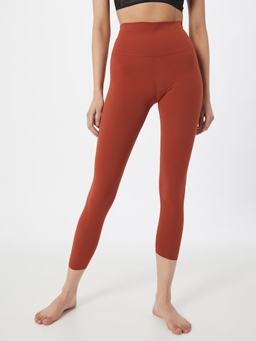 NIKE Skinny Sportbroek in Oranje: voorkant