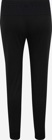 Effilé Pantalon 'F.C. Tribuna' Nike Sportswear en noir