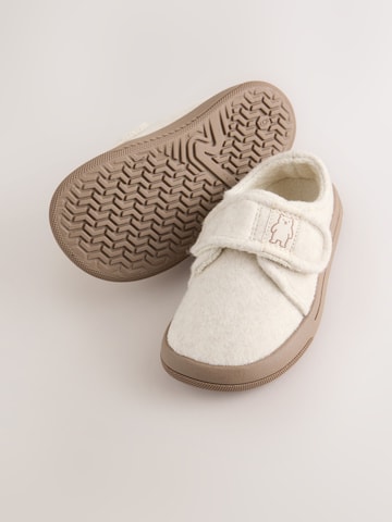 Neonato di Next in beige