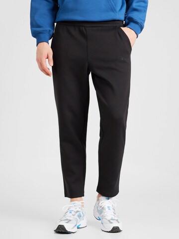 Loosefit Pantaloni sport 'American' de la Champion Authentic Athletic Apparel pe negru: față