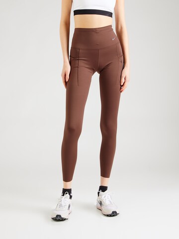 NIKE Skinny Workout Pants in Brown: front