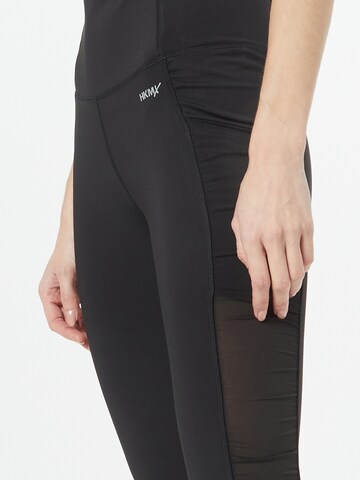 Skinny Pantaloni sportivi di HKMX in nero