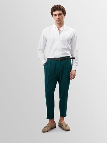 Antioch Tapered Pleat-front trousers in Green: front