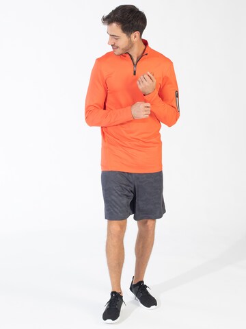 Spyder - Sweatshirt de desporto em laranja