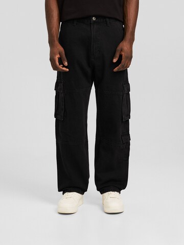 Loosefit Jeans cargo Bershka en noir : devant