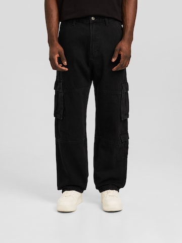 Bershka Loosefit Cargojeans i svart: forside