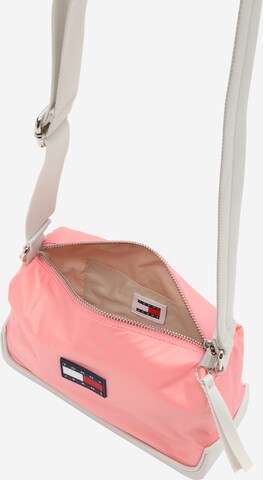 Tommy Jeans Skuldertaske 'UNCOVERED' i pink