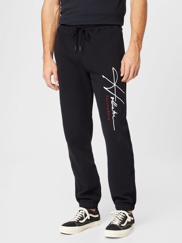 HOLLISTER Tapered Pants in Black: front