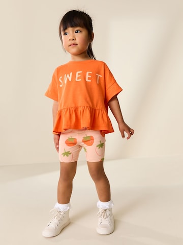 Next Set i orange: framsida