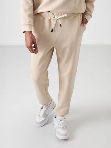 Tommy Life Joggingpak in Beige