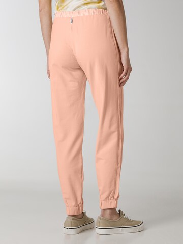 Tapered Pantaloni sportivi di DEHA in arancione