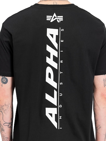 ALPHA INDUSTRIES T-shirt 'Rubber' i svart