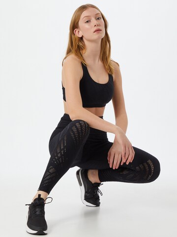 Skinny Pantaloni sportivi 'Selenite' di Onzie in nero