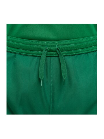 Loosefit Pantalon de sport NIKE en vert