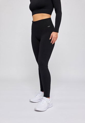 SNOCKS Skinny Workout Pants in Black: front