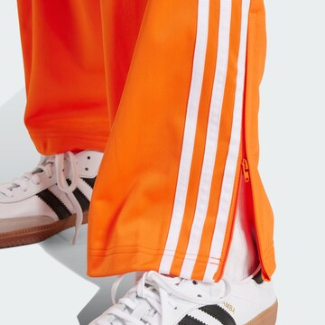 ADIDAS ORIGINALS Regular Broek 'Adicolor Classics Firebird' in Oranje