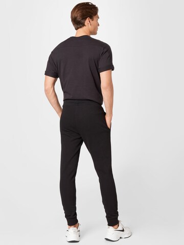 Effilé Pantalon de sport 4F en noir