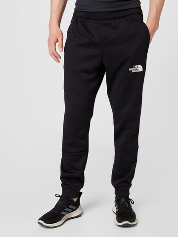 THE NORTH FACE Tapered Workout Pants in Black: front