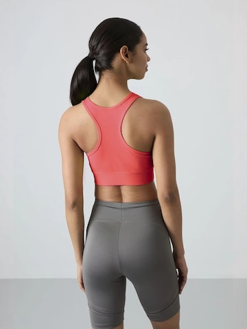 Tommy Life Sporttop in Oranje