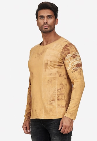 Rusty Neal Langarmshirt mit plakativem Front & Back Print in Braun: predná strana