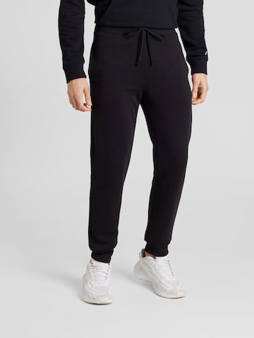 Champion Authentic Athletic Apparel - Tapered Pantalón 'Legacy' en negro: frente