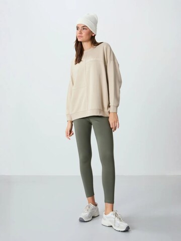 Sweat-shirt Tommy Life en beige