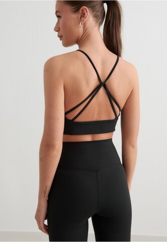 Bustino Reggiseno sportivo di Aim'n in nero