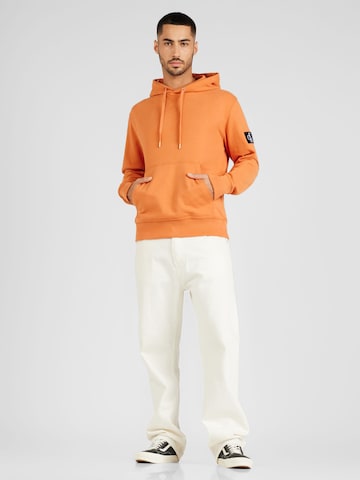 Calvin Klein Jeans Свитшот в Оранжевый