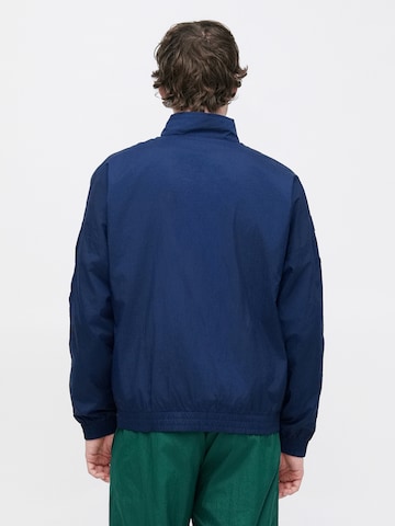 ADIDAS ORIGINALS Overgangsjakke 'ARCH' i blå