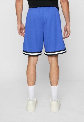 Karl Kani - Loosefit Calças 'Essential' em azul