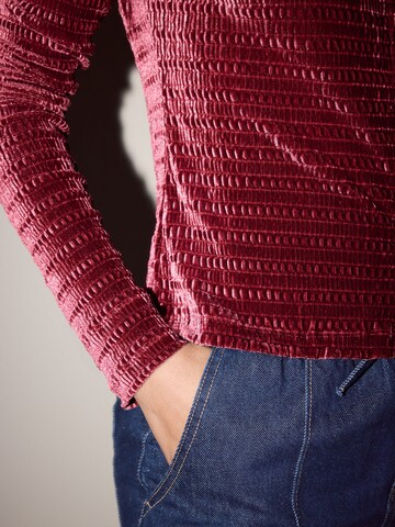 sarkans Next Adīta jaka