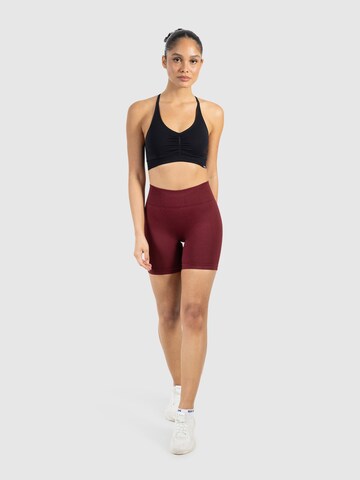 Coupe slim Pantalon de sport ' Nomeli ' Smilodox en rouge