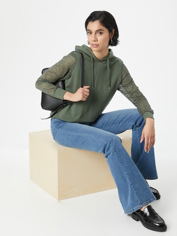 ABOUT YOU Sweatshirt 'Svenja' in Green