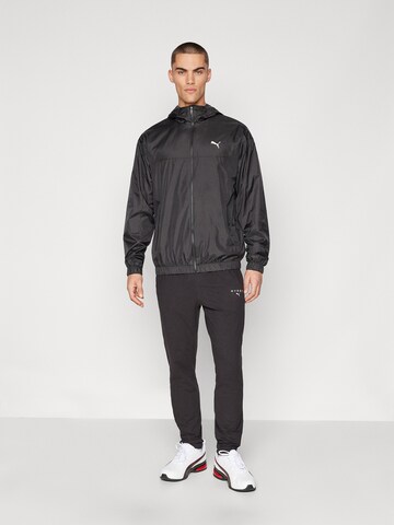 PUMA - Casaco deportivo 'ESS' em preto